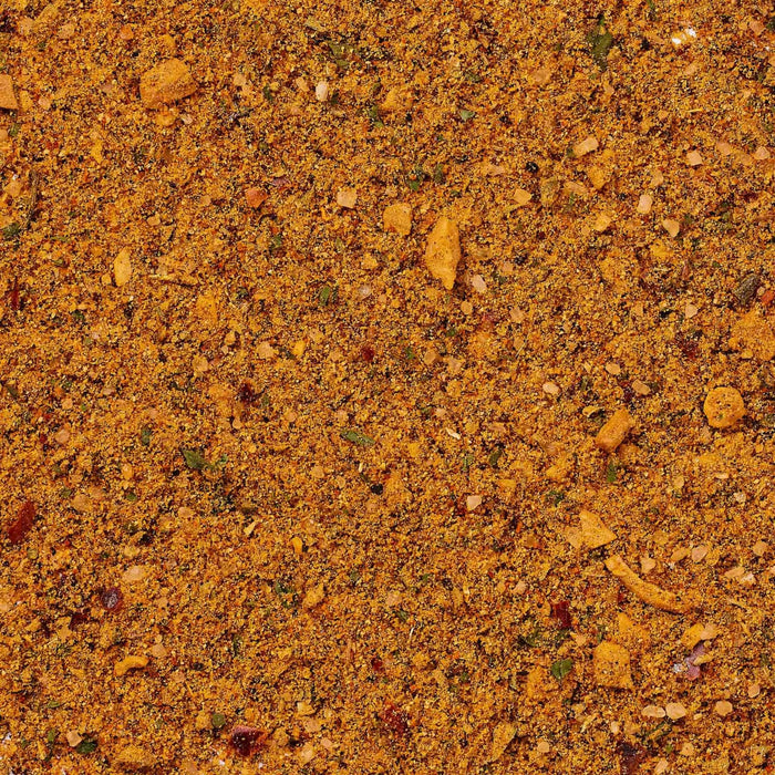 A detailed close up view shows the vibrant texture and blended ingredients of Cholula Medium Chili Garlic Taco Seasoning Mix 1 Oz.