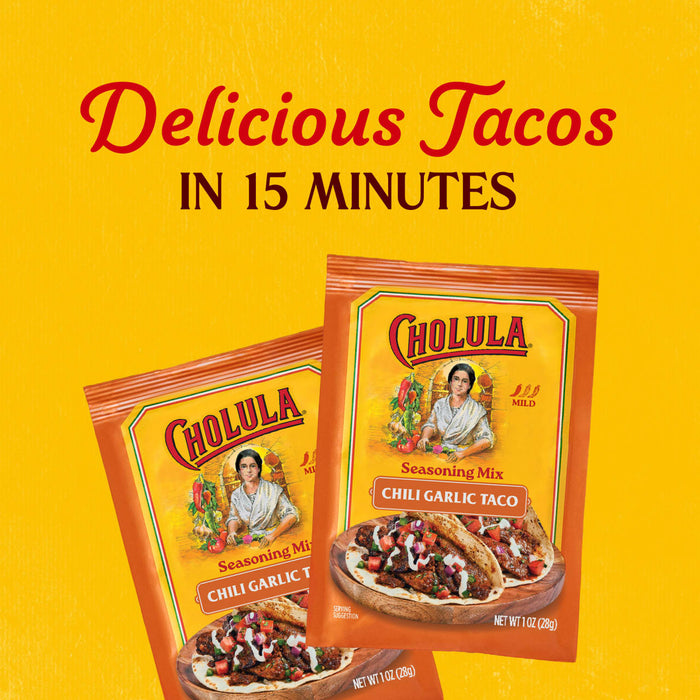 Two packets of Cholula Medium Chili Garlic Taco Seasoning Mix 1 Oz are displayed against a bright yellow background with text promising delicious tacos in 15 minutes.
