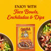 A packet of Cholula Medium Chili Garlic Taco Seasoning Mix 1 Oz is displayed against a bright yellow background between two fresh steak taco bowls to show how it can be enjoyed with taco bowls, enchiladas, and dips.