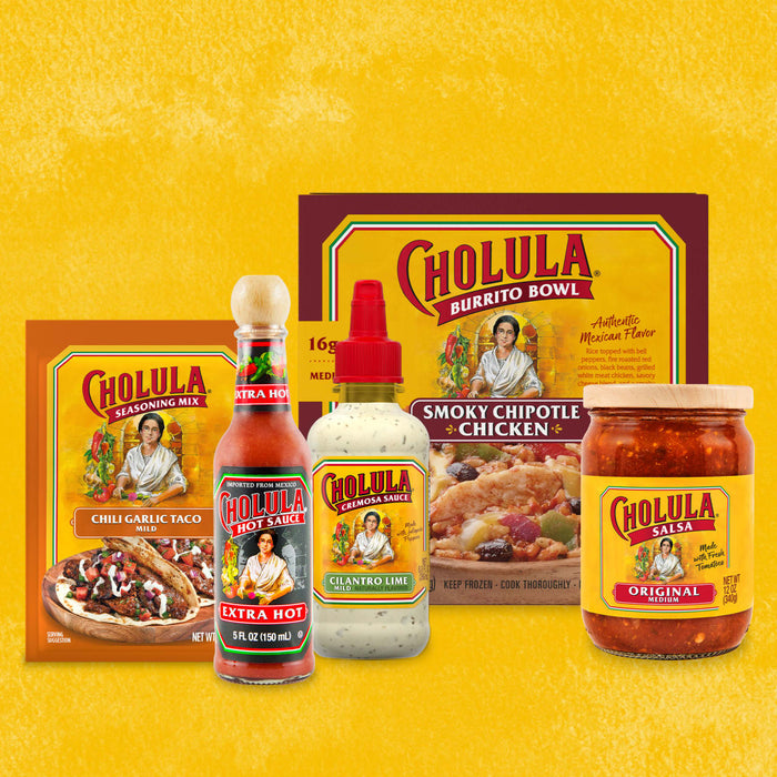A collection of Cholula hot sauce products, including a seasoning mix, hot sauce, salsa, and a cremosa sauce.