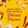A vibrant blend of sweet, spicy, and tangy flavors is showcased with garlic cloves, dried chili peppers, and hibiscus flowers scattered on a yellow background.