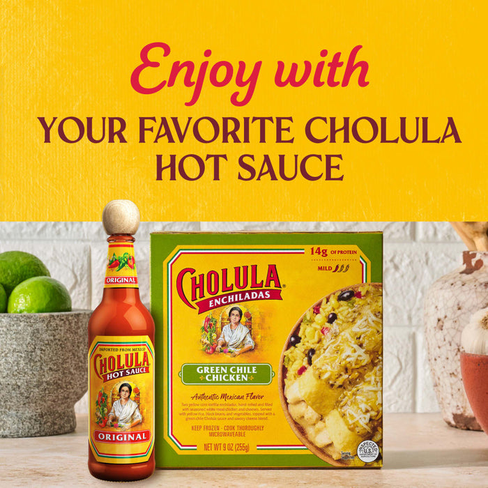 A bottle of Cholula hot sauce and a box of Cholula Chicken Chili Rice Kit are displayed with limes, suggesting the hot sauce can be enjoyed with the rice kit.