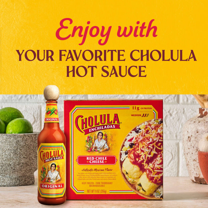 A Cholula hot sauce bottle and a Cholula enchilada dinner kit are displayed with limes, promoting the brands products.