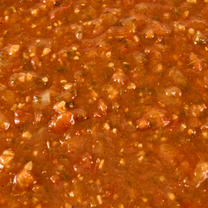 A close-up shot of chunky, homemade-style salsa.