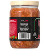 The back label of a glass jar of Cholula Original Hot Red Salsa 12 Oz describes its extra hot spice level and authentic Mexican flavor, listing ingredients like fresh tomatoes and árbol peppers.