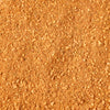 A close-up view of a pile of finely ground, orange-brown spice.