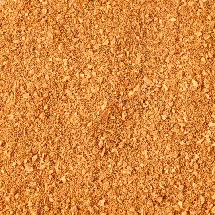 A close-up view of a pile of finely ground, orange-brown spice.