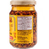A jar of Cholula Chili Crisp Sauce with Pepitas, showcasing the product's label and ingredients.