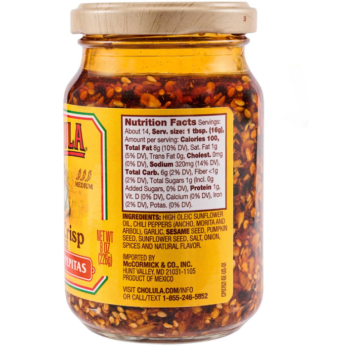 A jar of Cholula Chili Crisp Sauce with Pepitas, showcasing the product's label and ingredients.