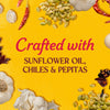 The image showcases the ingredients used in the product including sunflower oil chiles and pepitas set against a vibrant yellow background.