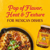 A jar of Cholula Chili Crisp Sauce is featured next to a skillet of cheesy Mexican dip with the text Pop of Flavor Heat &amp; Texture for Mexican Dishes above.