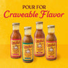 Four bottles of Cholula sauces including Original Taco Carne Asada Birria and Fajita are displayed against a yellow background with the text Pour For Craveable Flavor.