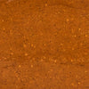 A textured reddish-brown surface with small scattered particles creates a warm and earthy visual.