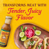 A bottle of Cholula Carne Asada Marinade &amp; Cooking Sauce is featured alongside a plate of tacos with lime and pickled onions with the text Transforms Meat With Tender Juicy Flavor above.
