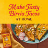 A bottle of Cholula Birria Cooking &amp; Simmer Sauce is featured next to a plate of birria tacos with the text Make Tasty Birria Tacos at Home above.