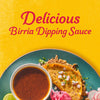 A plate of birria tacos with a side of dipping sauce is shown advertising the delicious birria dipping sauce.