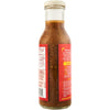 A bottle of Cholula Fajita Cooking Sauce with a wooden cap, showcasing its ingredients and a recipe for smoky fajitas.