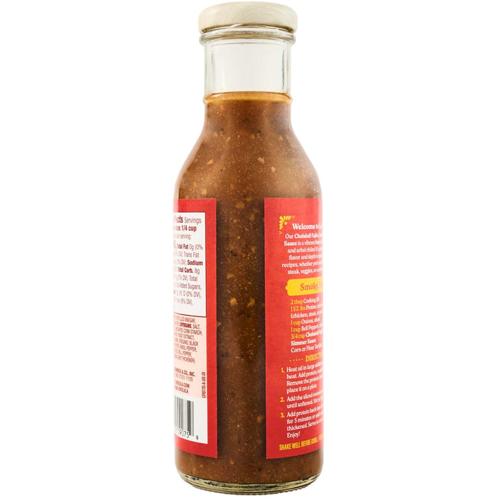 A bottle of Cholula Fajita Cooking Sauce with a wooden cap, showcasing its ingredients and a recipe for smoky fajitas.