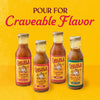 Four bottles of Cholula brand sauces including Original Taco Fajita Birria and Carne Asada are displayed against a yellow background with the text Pour For Craveable Flavor.