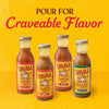 Four bottles of Cholula brand sauces including Original Taco Fajita Birria and Carne Asada are displayed against a yellow background with the text Pour For Craveable Flavor.