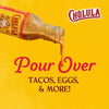 A bottle of Cholula hot sauce is tilted pouring sauce over the words Pour Over Tacos Eggs &amp; More!
