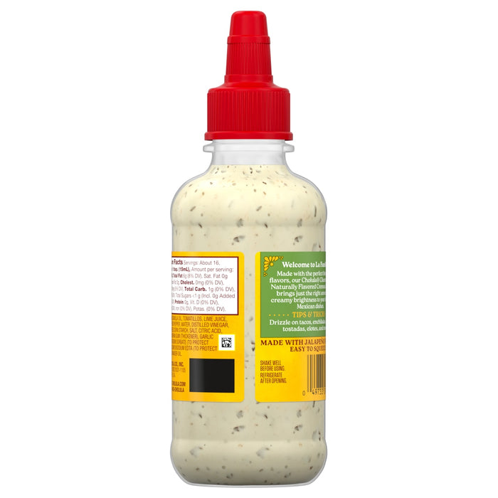 A bottle of Cholula Cilantro Naturally Flavored Crema, a creamy condiment made with jalapeA?os, is shown.