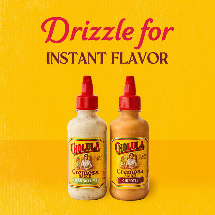 Two bottles of Cholula Cremosa Sauce one Cilantro Lime and one Chipotle are displayed with the text Drizzle for Instant Flavor above them.