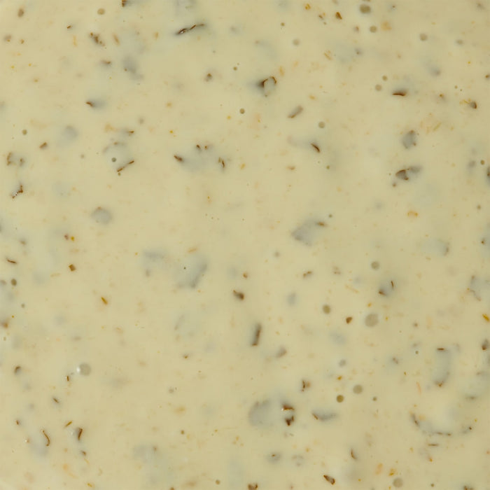 A close-up shot of a creamy speckled sauce.