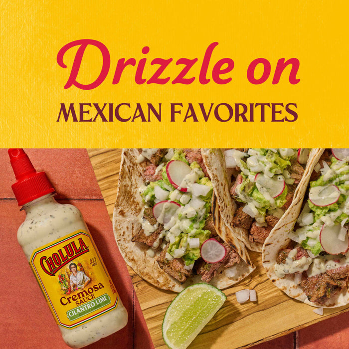 A bottle of Cholula Cremosa Cilantro Lime sauce is featured next to tacos promoting its use on Mexican favorites.