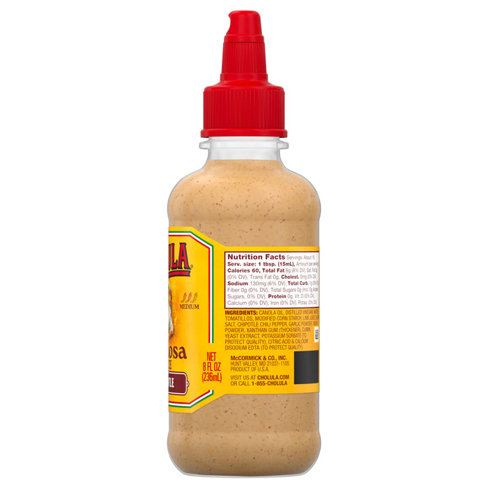 A bottle of Cholula Chipotle Creamy Sauce with a red cap and a label showing nutrition facts and ingredients.