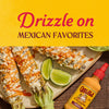 Cholula Cremosa Chipotle sauce is drizzled on Mexican street corn, a popular Mexican favorite.