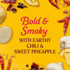 A vibrant image promoting a bold and smoky flavor profile with earthy chili and sweet pineapple.