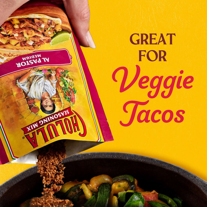 A hand pours Cholula taco seasoning into a pan of vegetables, highlighting its use for veggie tacos.