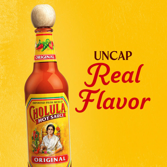 A bottle of Cholula Original Hot Sauce with the text Uncap Real Flavor in the background.