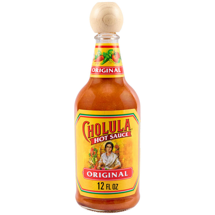 A bottle of Cholula Original Hot Sauce, featuring its iconic yellow label with a woman in traditional attire, the brand name, and Original 12 FL OZ, all beneath a distinctive wooden cap.