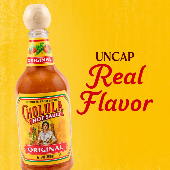 A bottle of Cholula Original Hot Sauce stands on a vibrant yellow background with the text Uncap Real Flavor