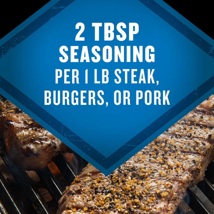 The image shows a close-up of seasoned steak, burgers, or pork on a grill, with a blue diamond-shaped overlay stating 2 TBSP Seasoning Per 1 LB Steak, Burgers, or Pork.