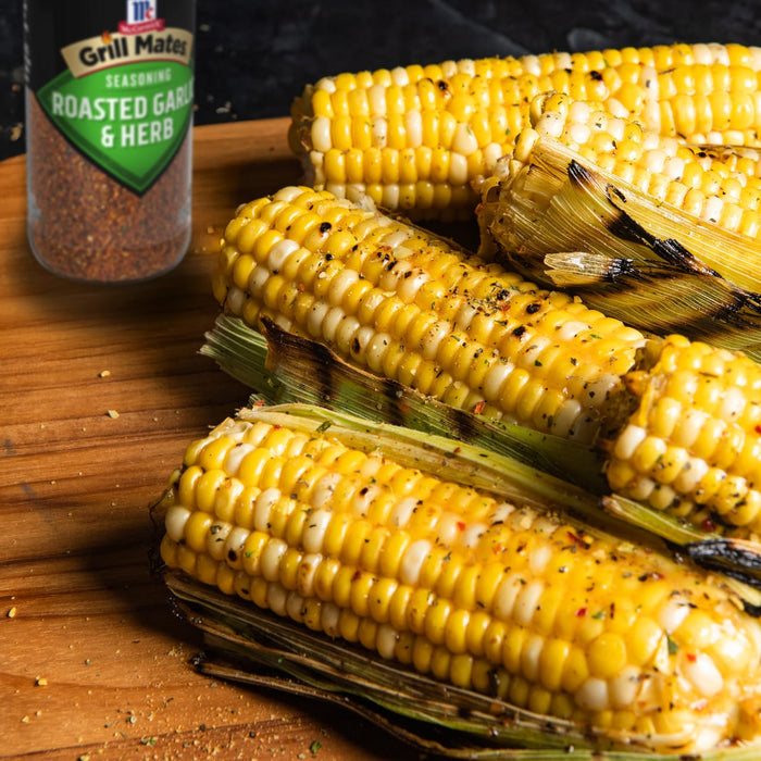 Grilled corn on the cob seasoned with Grill Mates Roasted Garlic &amp; Herb seasoning.