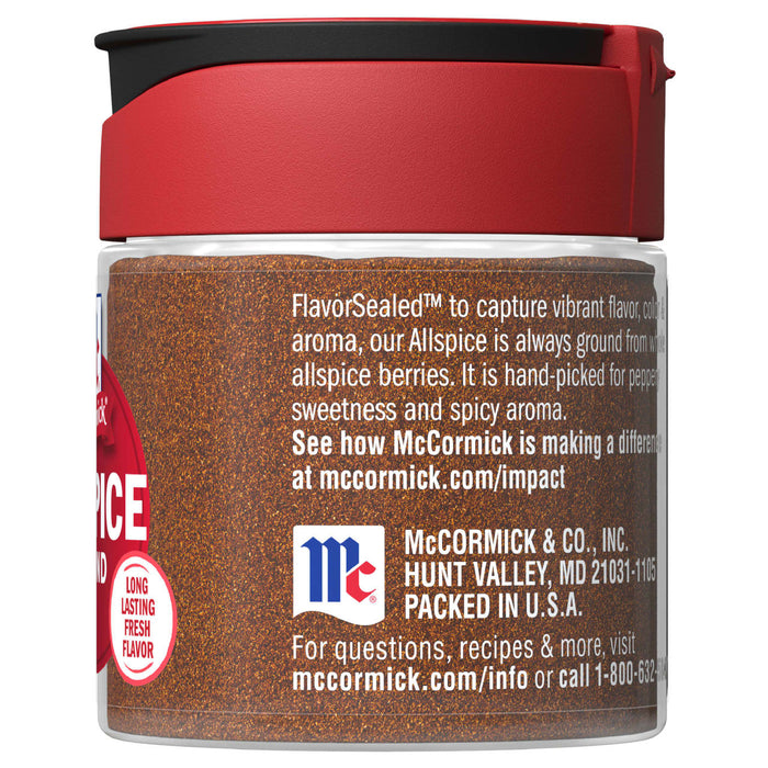 A glass jar of McCormick Allspice.