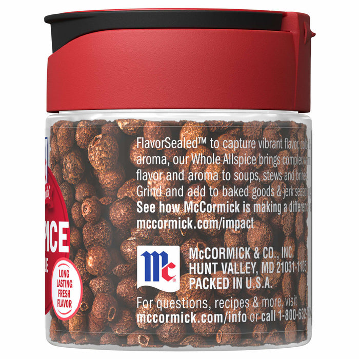 A glass jar of McCormick Whole Allspice.