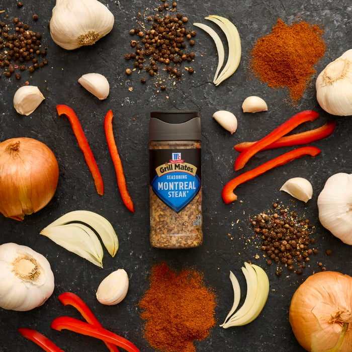McCormick's Roasted Garlic &amp; Vegetable spice blend is showcased amidst fresh ingredients like garlic, onions, peppers, and spices, highlighting its versatility in cooking.