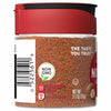 A glass jar of McCormick Ground Nutmeg.