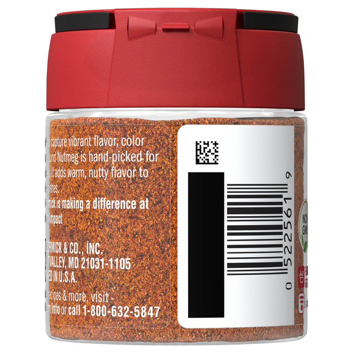 A glass jar of McCormick Ground Nutmeg with a red lid.