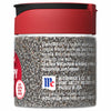 A McCormick brand glass jar of poppy seeds with a red lid.