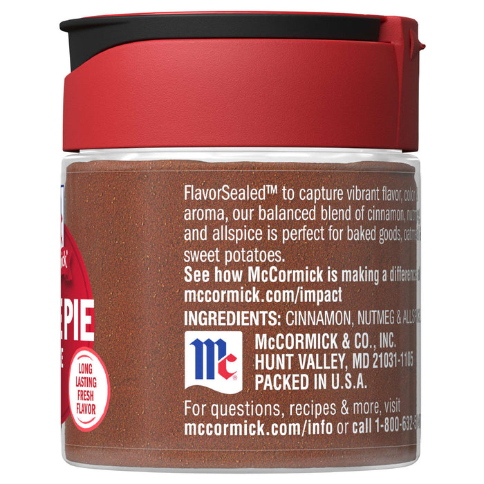 A glass jar of McCormick Pie Spice with a red lid.