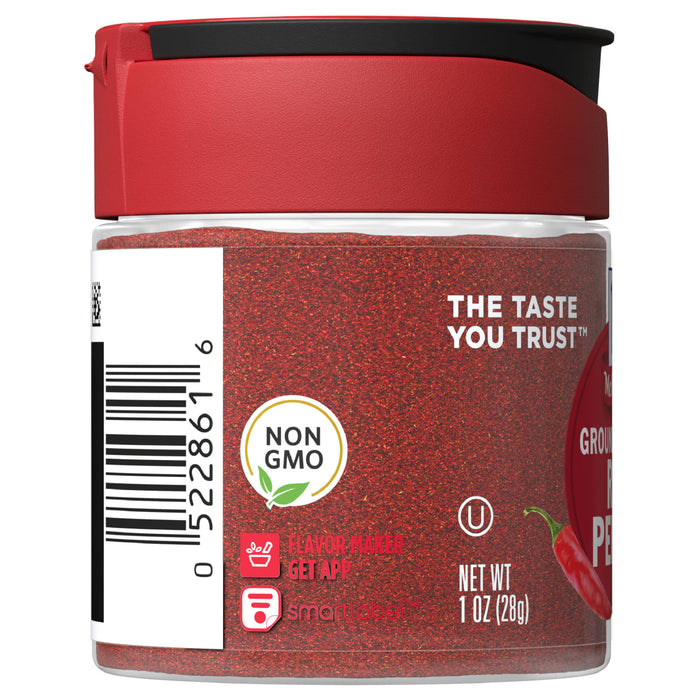 A red jar of McCormick Ground Red Pepper with a white label that says The Taste You Trust and Non GMO.