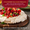 A Strawberry Balsamic Pavlova dessert from McCormick, featuring a light, crisp meringue topped with sweet-tart strawberries and fragrant cream.