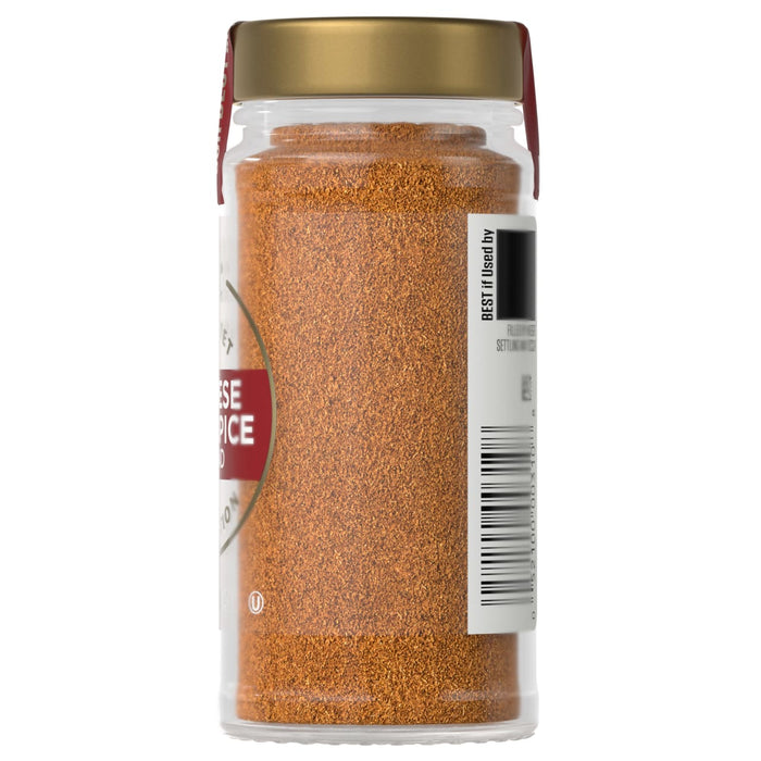 A jar of McCormick Chili Spice is shown, highlighting the product's color and packaging.