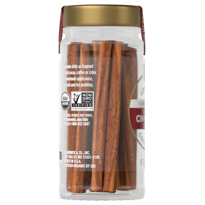 A jar of McCormick Organic Cinnamon Sticks is shown, highlighting its use in hot cocoa, coffee, cider, applesauce, fruit, and rice pudding.
