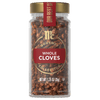 A jar of McCormick Gourmet Whole Cloves Collection is displayed, showcasing the brand and product.